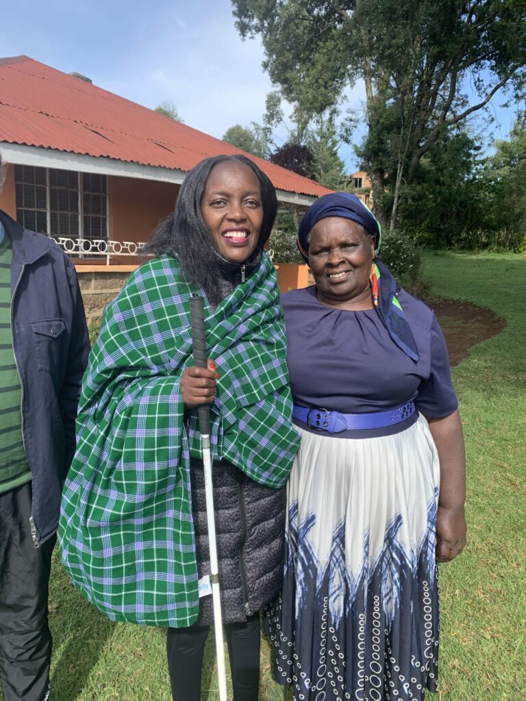 Helen and another woman smiling broadly