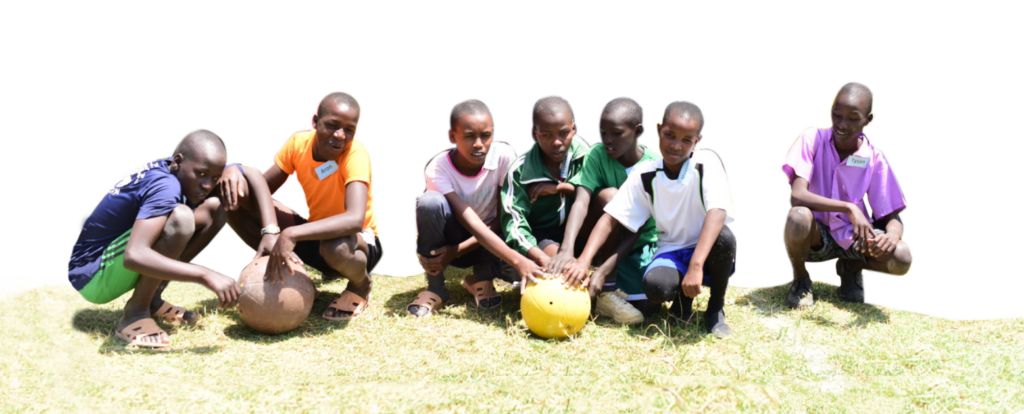 Children from Camp Possibilities International with their hands on a ball.