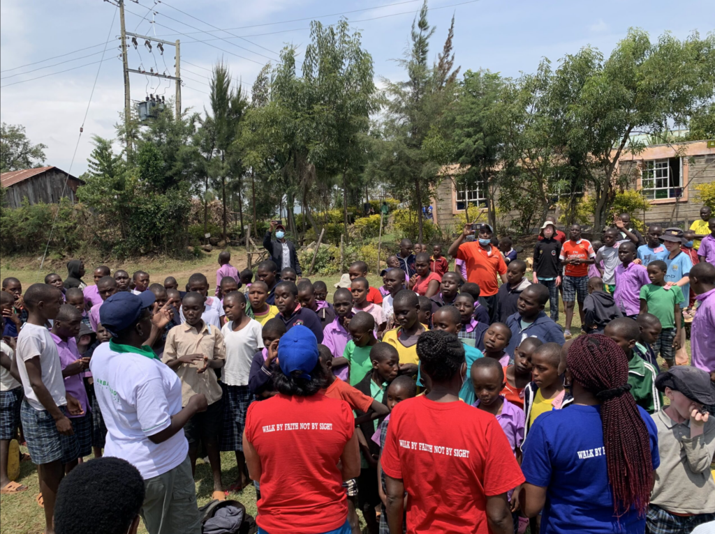 The community gathered in a circle for an event.