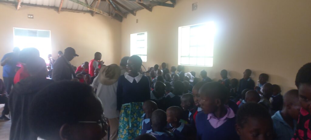 Kids in the school's dining hall receiving the Donation at Korara 